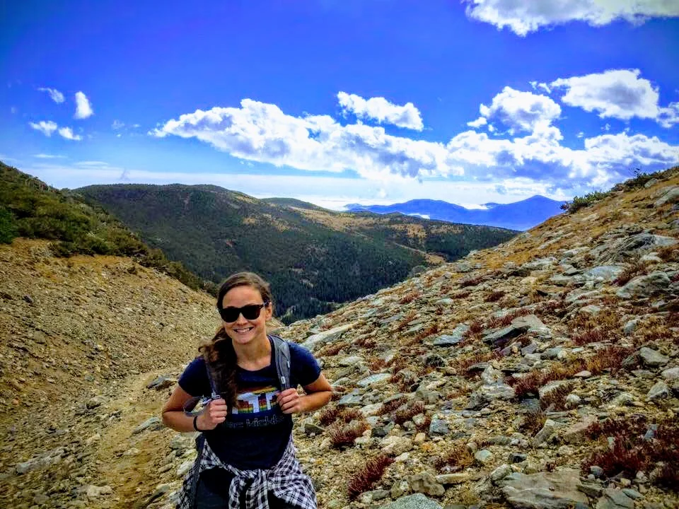 Lisa Collins hiking on a mountain trail